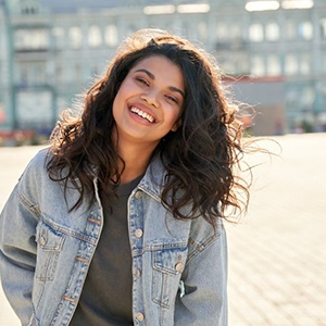 Teen smiles outdoors