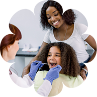 Pediatric dentist showing a young boy his smile in a mirror