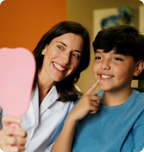 photo of smiling team member with child patient