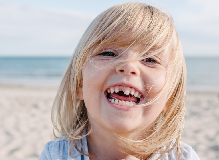 Child with missing front tooth