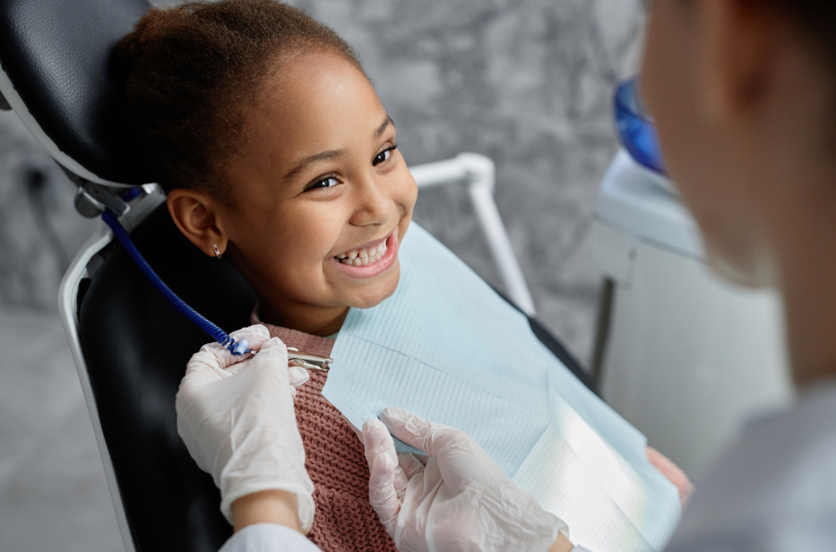Child smiling at dentist